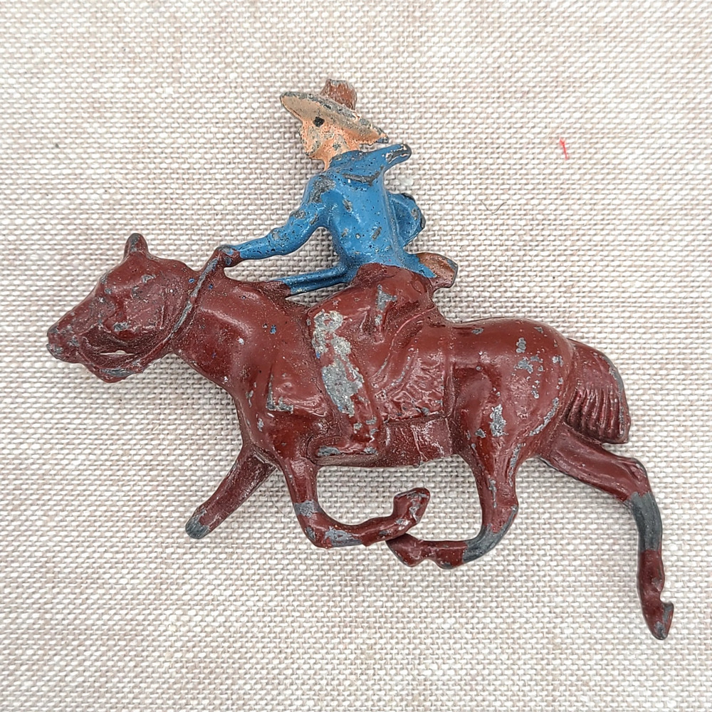 Vintage Metal Cowboy on Horse Figurine Made in England miniatures